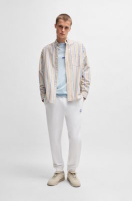 Cotton-terry tracksuit bottoms with Happy HUGO, White