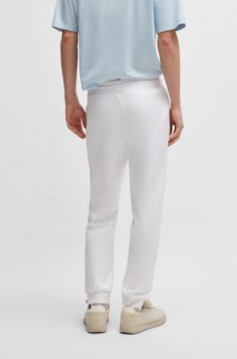 Cotton-terry tracksuit bottoms with Happy HUGO, White