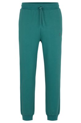 Hugo Boss Cotton-terry Tracksuit Bottoms With Smiley-face Logo Patch In Green