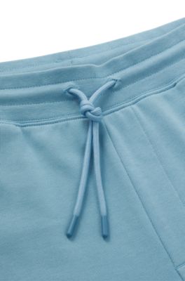 Cotton-terry tracksuit bottoms with Happy HUGO, Light Blue