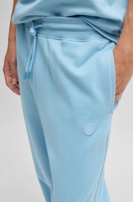 Cotton-terry tracksuit bottoms with Happy HUGO, Light Blue
