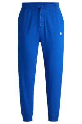 Hugo Boss Cotton-terry Tracksuit Bottoms With Smiley-face Logo Patch In Light Blue