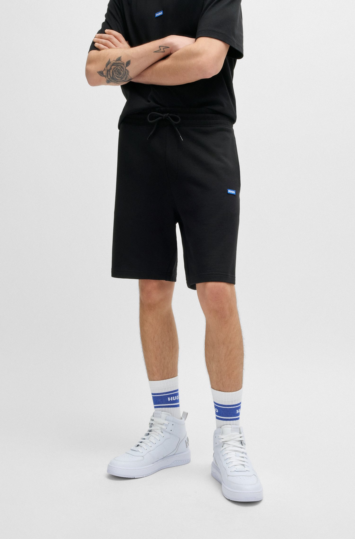 Cotton-terry shorts with blue logo patch