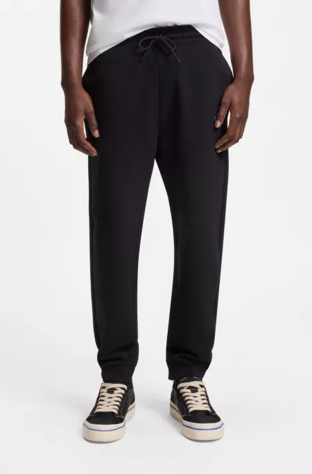 Cotton-terry sweatpants with logo patch
