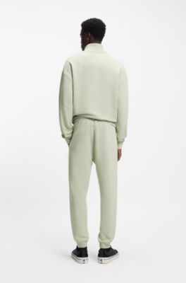 Pantalones de ch&aacute;ndal en felpa de algod&oacute;n con parche de logo azul, Cal