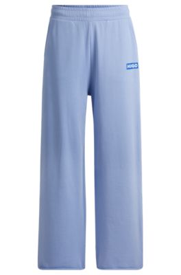 Shop Hugo Relaxed-fit Tracksuit Bottoms With Logo Print In Blue