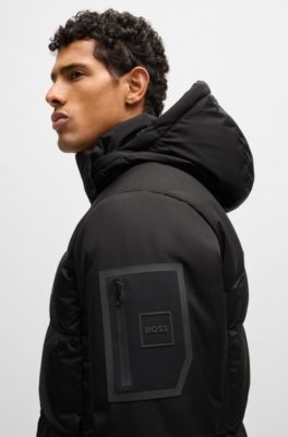 Chaqueta de plum&oacute;n repelente al agua con capucha extra&iacute;ble, Negro