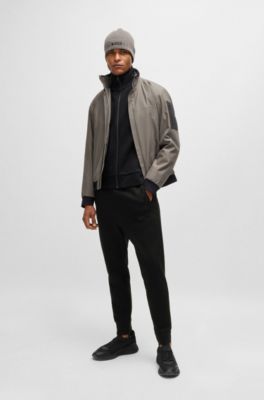 Tracksuit bottoms with mirror-effect logo, Black