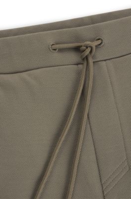 Tracksuit bottoms with mirror-effect logo, Light Green