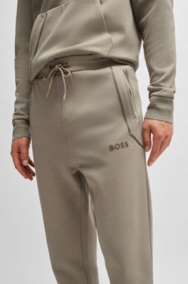 Tracksuit bottoms with mirror-effect logo, Light Green