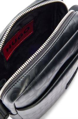 Reporter bag in faux leather with repeat-logo motif, Black