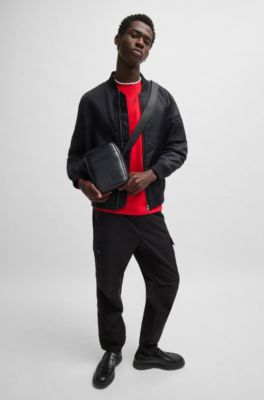 Reporter bag in faux leather with repeat-logo motif, Black