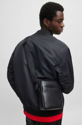 Reporter bag in faux leather with repeat-logo motif, Black