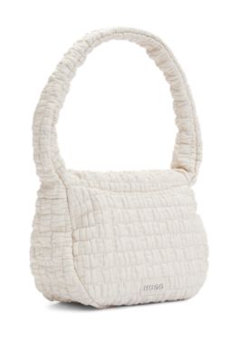 Shoulder bag in quilted-effect faux leather, White