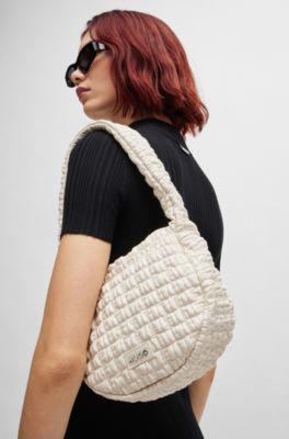 Shoulder bag in quilted-effect faux leather, White