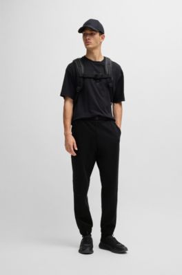 Pantalones de ch&aacute;ndal de forro polar aglomerado con detalle de logo, Negro