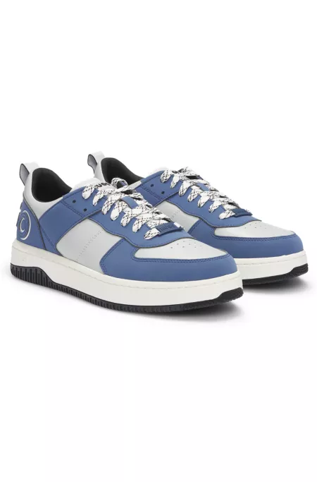 Mixed-material trainers with two sets of laces