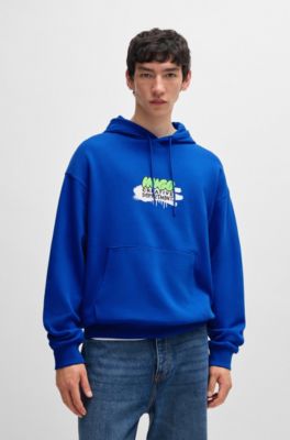HUGO - Cotton-terry hoodie with spray-paint graphic - Light Blue