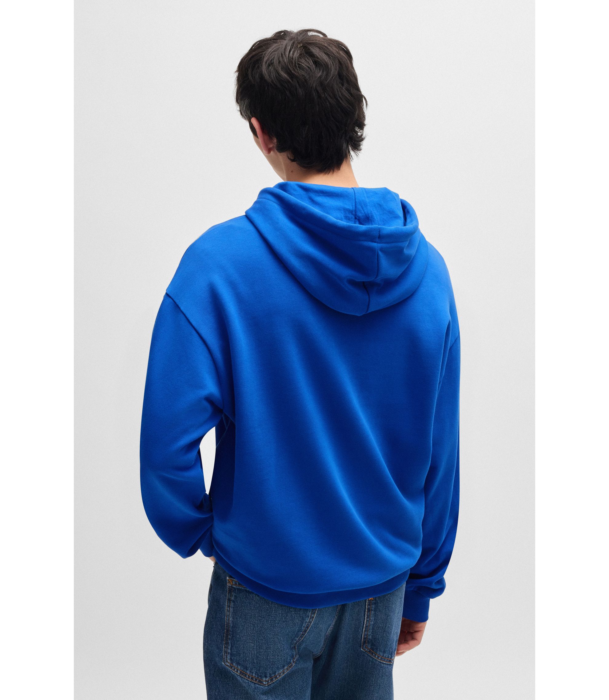 HUGO - Cotton-terry hoodie with spray-paint graphic - Light Blue