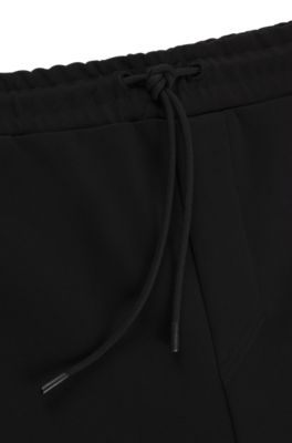 Pantalones de ch&aacute;ndal de algod&oacute;n con apliques de cinta, Negro