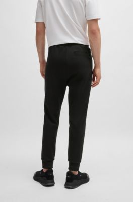 Pantalones de ch&aacute;ndal de algod&oacute;n con apliques de cinta, Negro