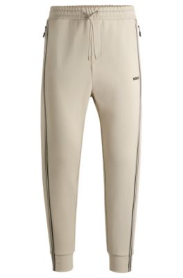 Hugo Boss Tracksuit Bottoms With Tape Inserts In Light Beige