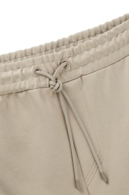 Pantalones de ch&aacute;ndal de algod&oacute;n con apliques de cinta, Beige claro