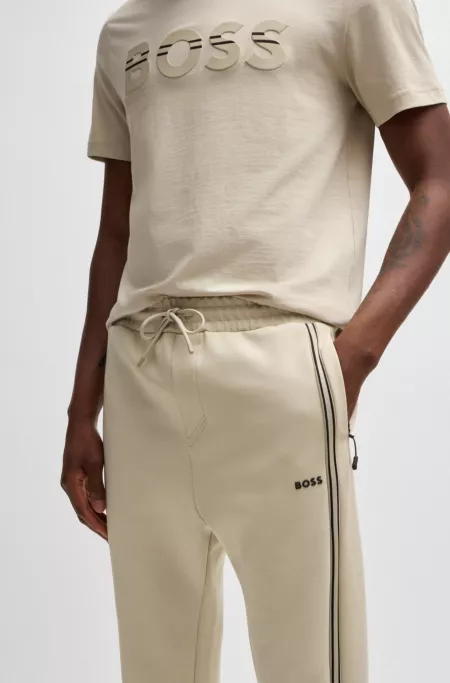 Tracksuit bottoms with tape inserts