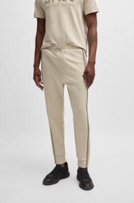 Tracksuit bottoms with tape inserts