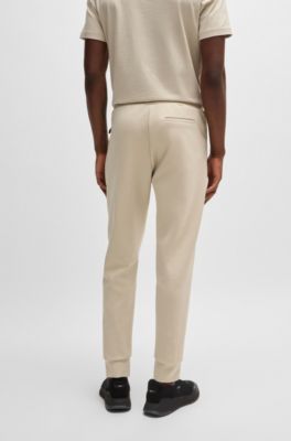 Pantalones de ch&aacute;ndal de algod&oacute;n con apliques de cinta, Beige claro