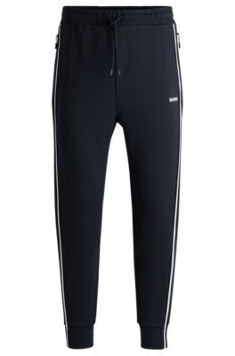 Pantalones de ch&aacute;ndal de algod&oacute;n con apliques de cinta, Azul oscuro