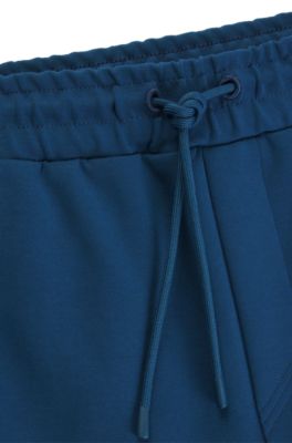 Pantalones de ch&aacute;ndal de algod&oacute;n con apliques de cinta, Celeste