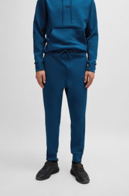 Pantalones de ch&aacute;ndal de algod&oacute;n con apliques de cinta, Celeste