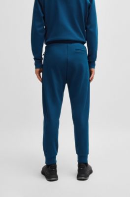 Pantalones de ch&aacute;ndal de algod&oacute;n con apliques de cinta, Celeste