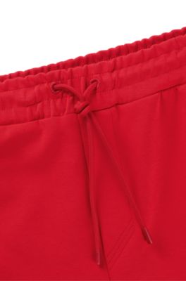 Pantalones de ch&aacute;ndal de algod&oacute;n con apliques de cinta, Rojo claro