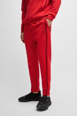 Pantalones de ch&aacute;ndal de algod&oacute;n con apliques de cinta, Rojo claro