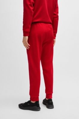 Pantalones de ch&aacute;ndal de algod&oacute;n con apliques de cinta, Rojo claro