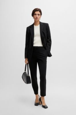 Pantalones slim fit de punto t&eacute;cnico el&aacute;stico, Negro