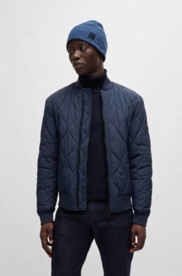 Ribbed beanie hat with contrasting logo label