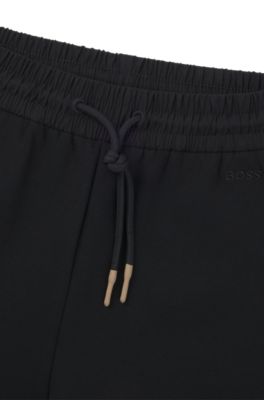 Tracksuit bottoms with adjustable hems, Black