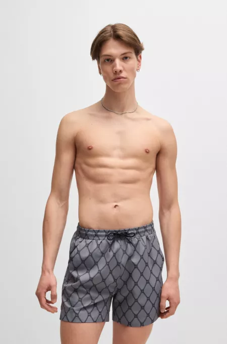 Swim shorts with stacked-logo print