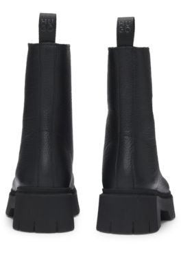 Ankle boots in tumbled leather with front zip, Black