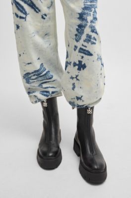 Ankle boots in tumbled leather with front zip, Black