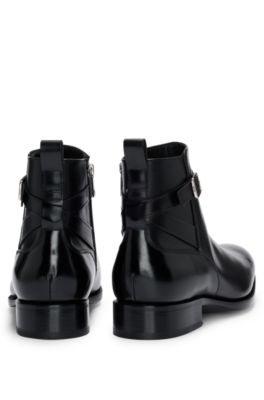 Leather jodhpur boots with zip closure and buckled strap, Black