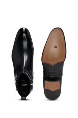 Leather jodhpur boots with zip closure and buckled strap, Black