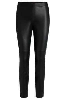 Paneled trousers in coated faux leather, Black