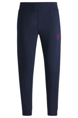 Logo-print tracksuit bottoms in stretch cotton, Dark Blue