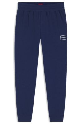 Pantalones de ropa de sal&oacute;n en algod&oacute;n el&aacute;stico con pu&ntilde;os y logo estampado, Azul oscuro
