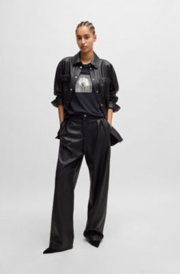 Pantalones loose fit de pernera ancha en piel sint&eacute;tica, Negro