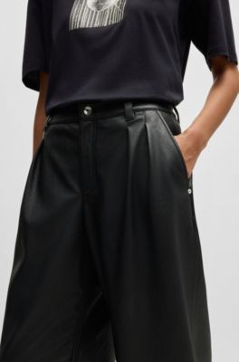 Pantalones loose fit de pernera ancha en piel sint&eacute;tica, Negro
